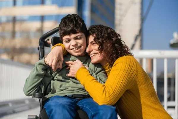 mother-hugging-her-son-disability